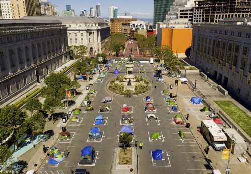 City-sanctioned homeless encampment near City Hall between the public library and the Asian Art Museum. Image - Noah Berger, AP...