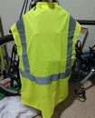 A medium yellow safety vest easily fits over the laptop bag...