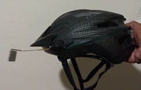 My Take A Look rear view mirror, clipped and taped to the visor of my bike helmet. I'll adjust the actual view when I get to ride again...