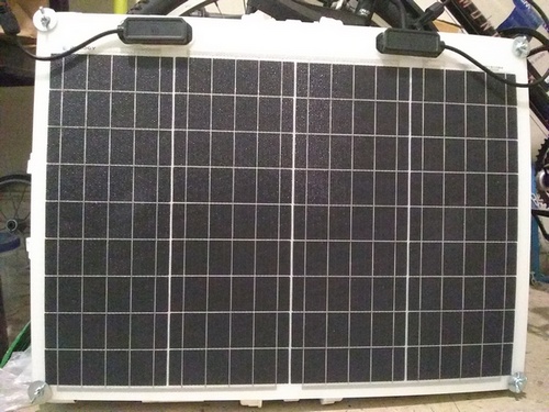 After a long slog, the flexible solar panel is mounted onto the mobile portable frame...