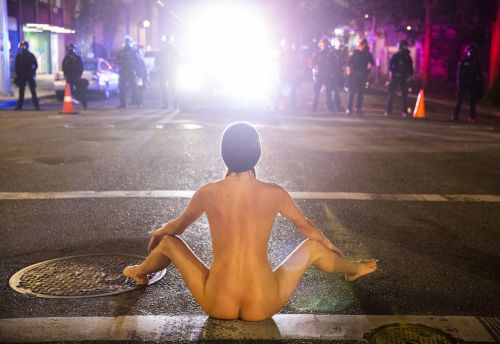 Image: Naked Athena vs Trump's Gestapo. Photo by Dave Killen, The Oregonian...